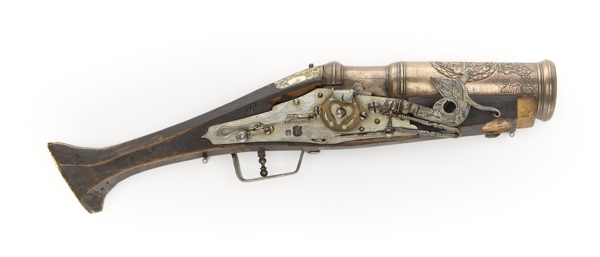 Figure 2 — A second wheellock grenade gun of 1593 from the same collection, this one plainer in its stock decoration but with the same architecture: an enormous stepped brass cup, a wheellock, and a stock tha…