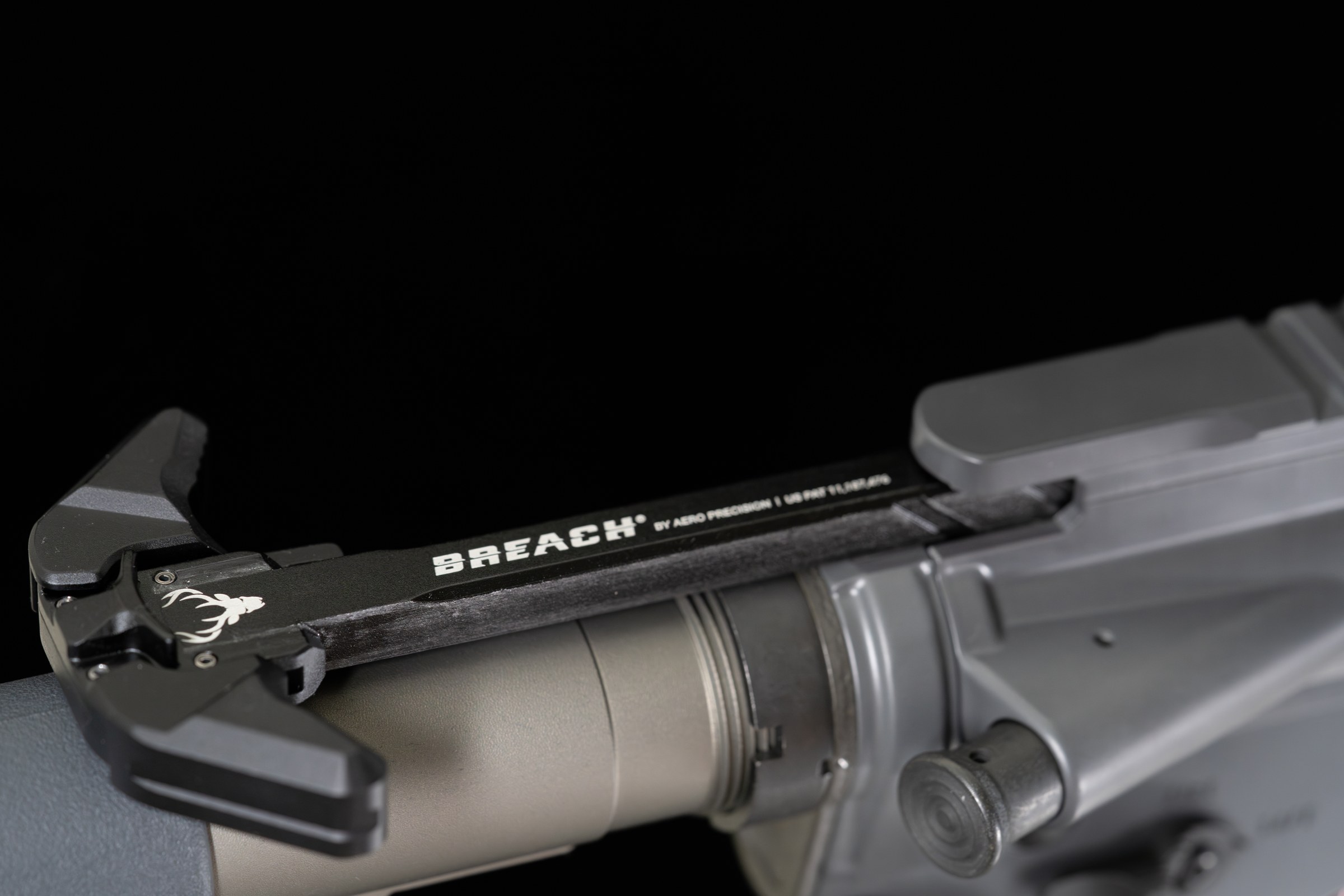 Figure 10 — The charging handle and upper receiver. Nothing visible from this side of the weapon indicates the chambering; the barrel is inside and forward of everything in this frame. Source: commons.wikimedi…