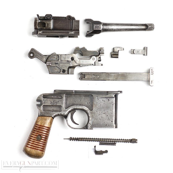 Figure 2 — 2 — A field-stripped C96 showing the major groups that un-interlock in sequence: barrel + barrel-extension, the square bolt, the lock sub-frame with hammer/sear/locking-block, and the maga…