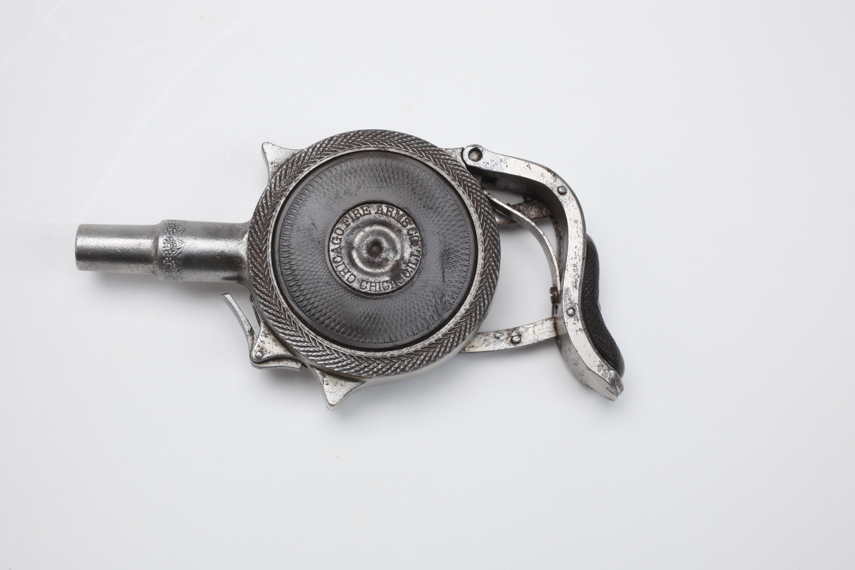 Figure 3 — The same specimen, left side. Two overall views show how little of the gun reads as a weapon. Source: nramuseum.org.