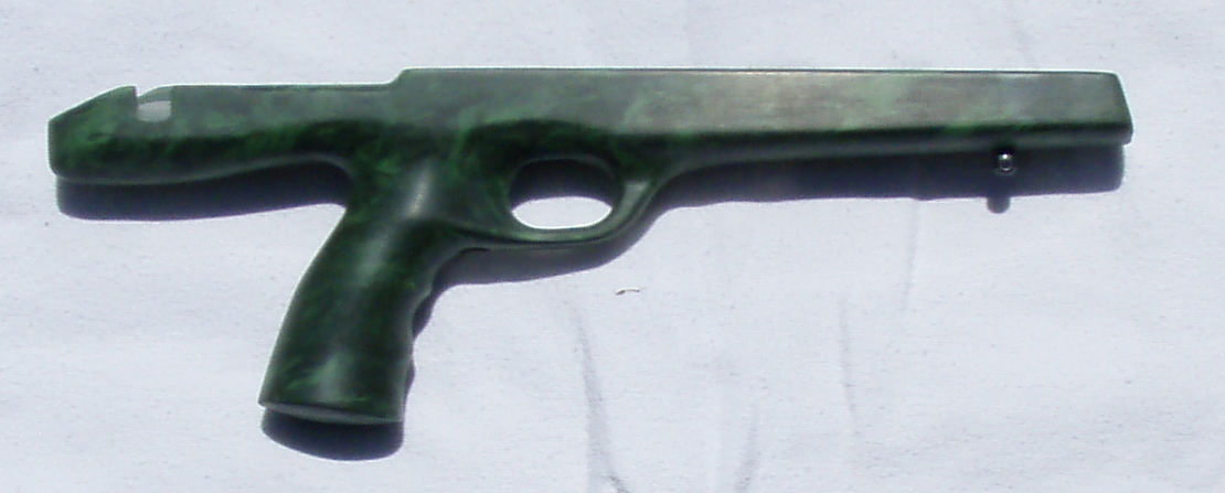 Figure 4 — A bare aftermarket McMillan fibreglass stock for the XP-100, rear-grip pattern, shown without a barrelled action fitted. Photo: File:McMillan xp100 right.jpg, via Wikimedia Commons.