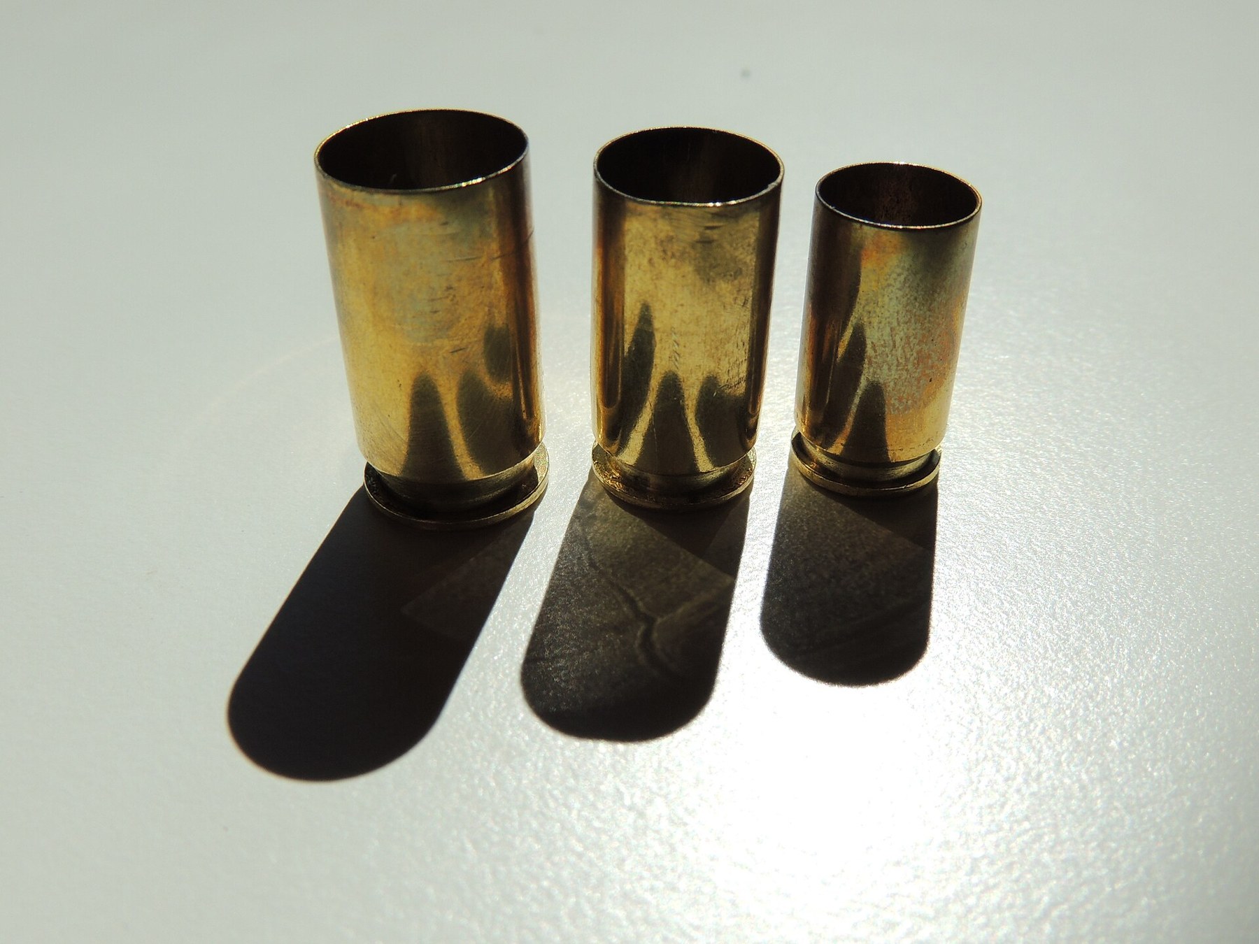 Figure 9 — Fired 9 mm, .40 S&W and .45 ACP cases, standing. The .40 in the middle is the case the rest of this section is about.
