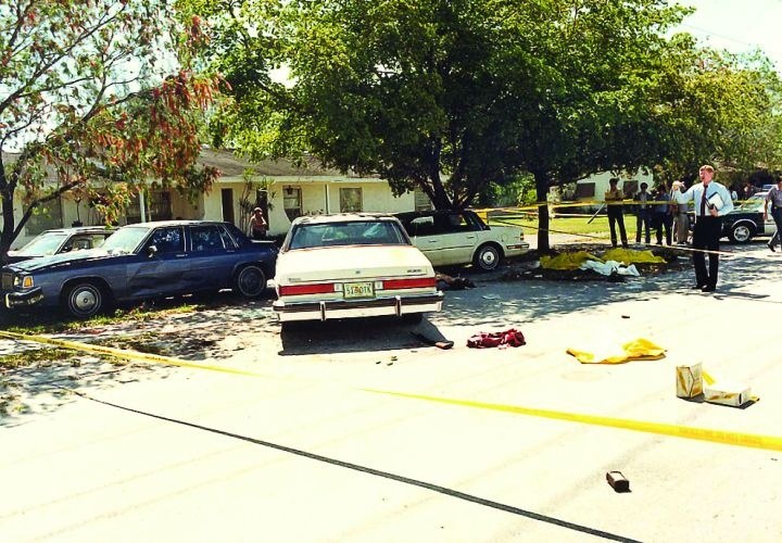 Figure 4 — The scene after the gunfight, photographed by the Miami-Dade Police Department. The vehicles are the suspects' and the agents'.
