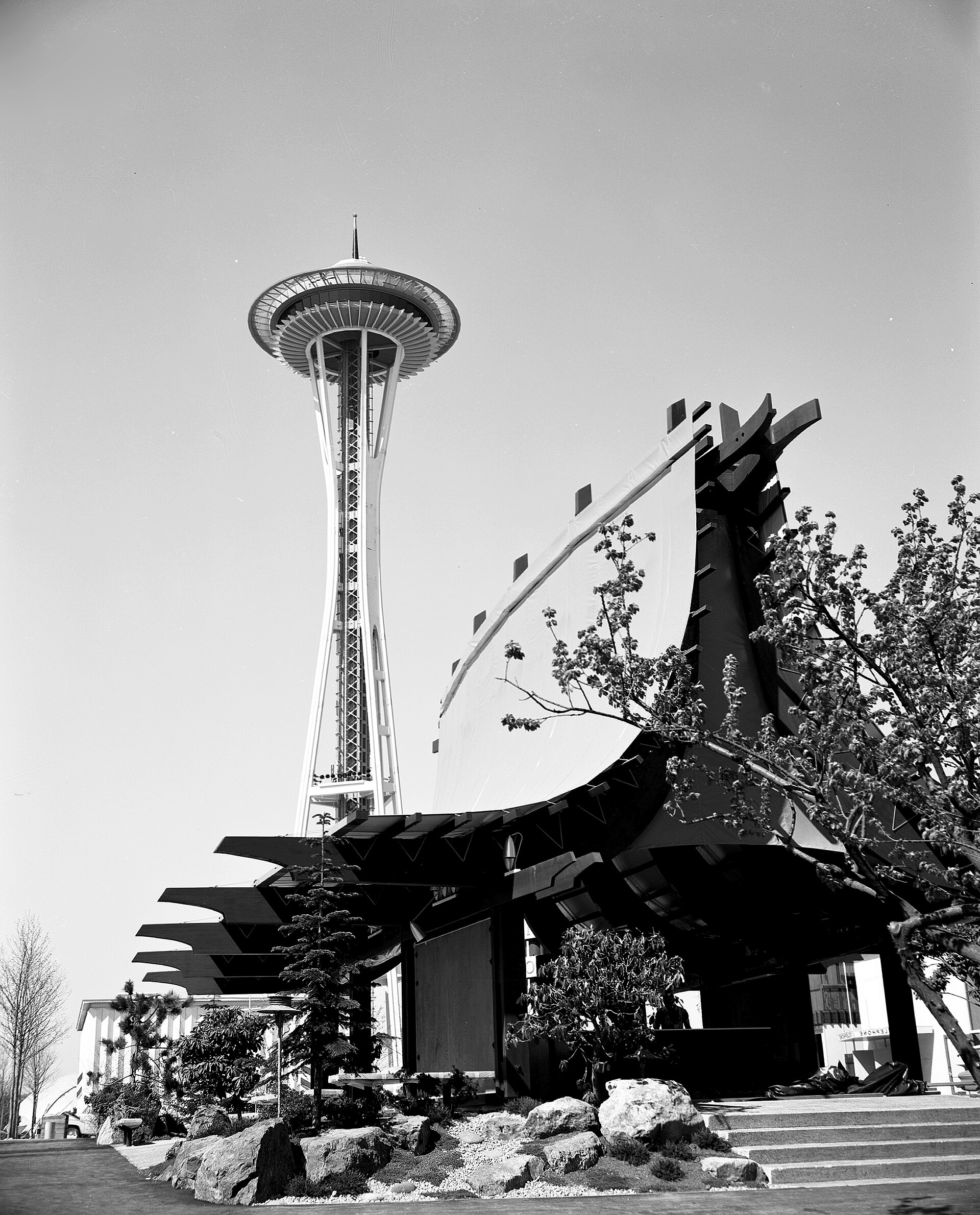 Figure 6 — An information booth at the Seattle World's Fair of 1962, with the Space Needle behind it: space-age styling at its public peak, six years after the Whitney appeared and in the year the last new Wh…