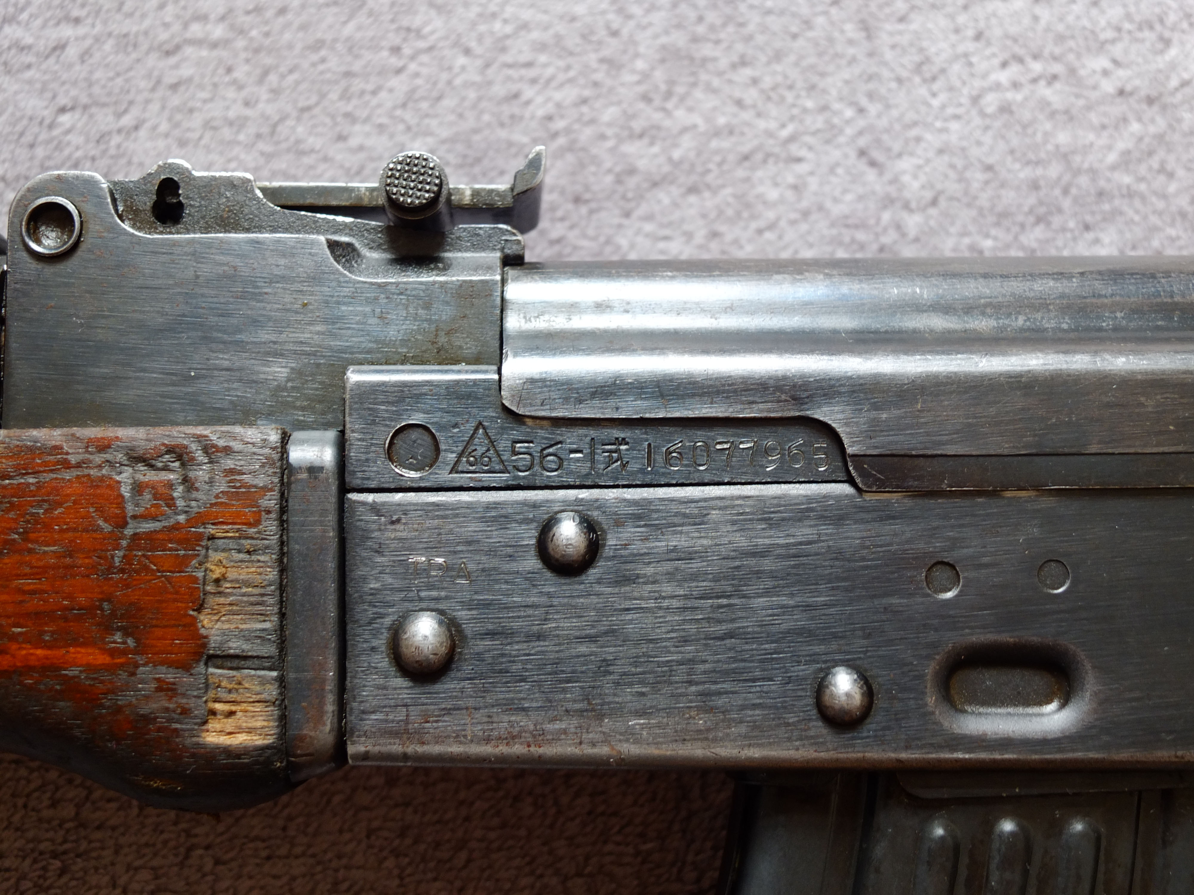 Figure 3 — The triangle-66 factory marking on a Chinese Type 56-1. That the mark is Chinese is certain; which plant it designates is not.