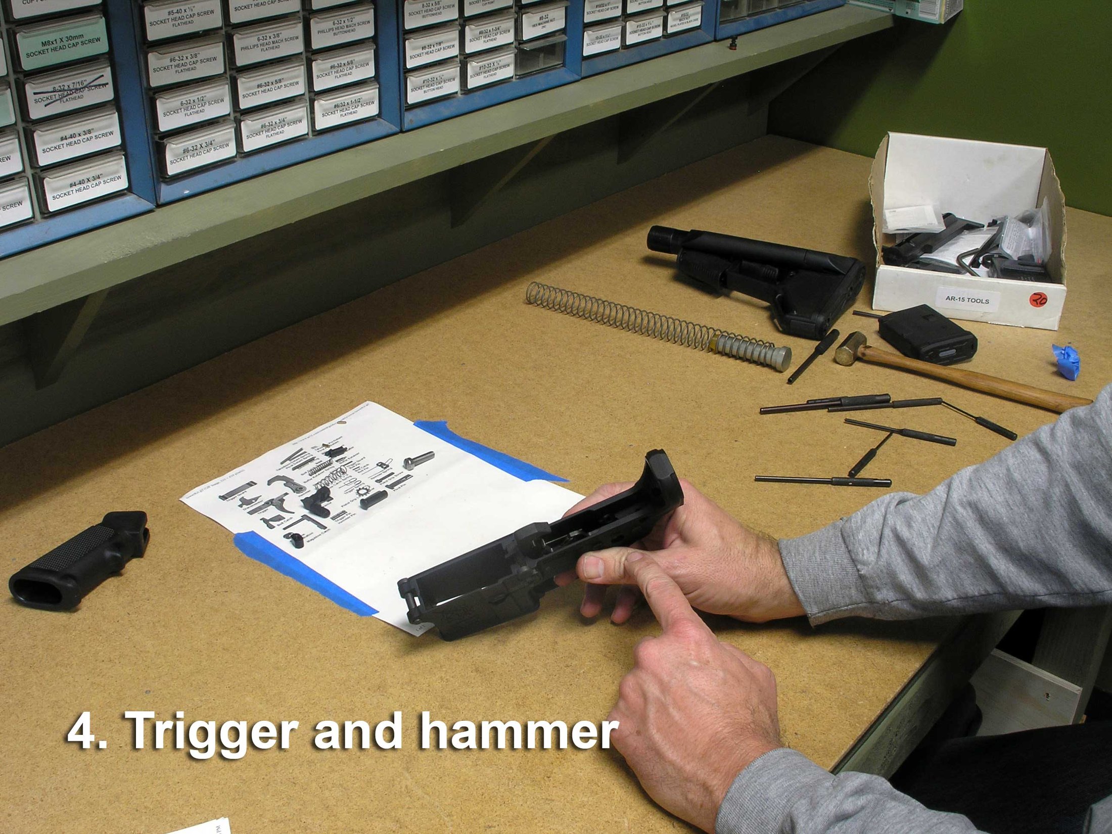 Figure 5 — The fire control group going into a lower receiver. This is the assembly step most commonly done badly, and the one a complete lower removes from the builder's hands entirely.