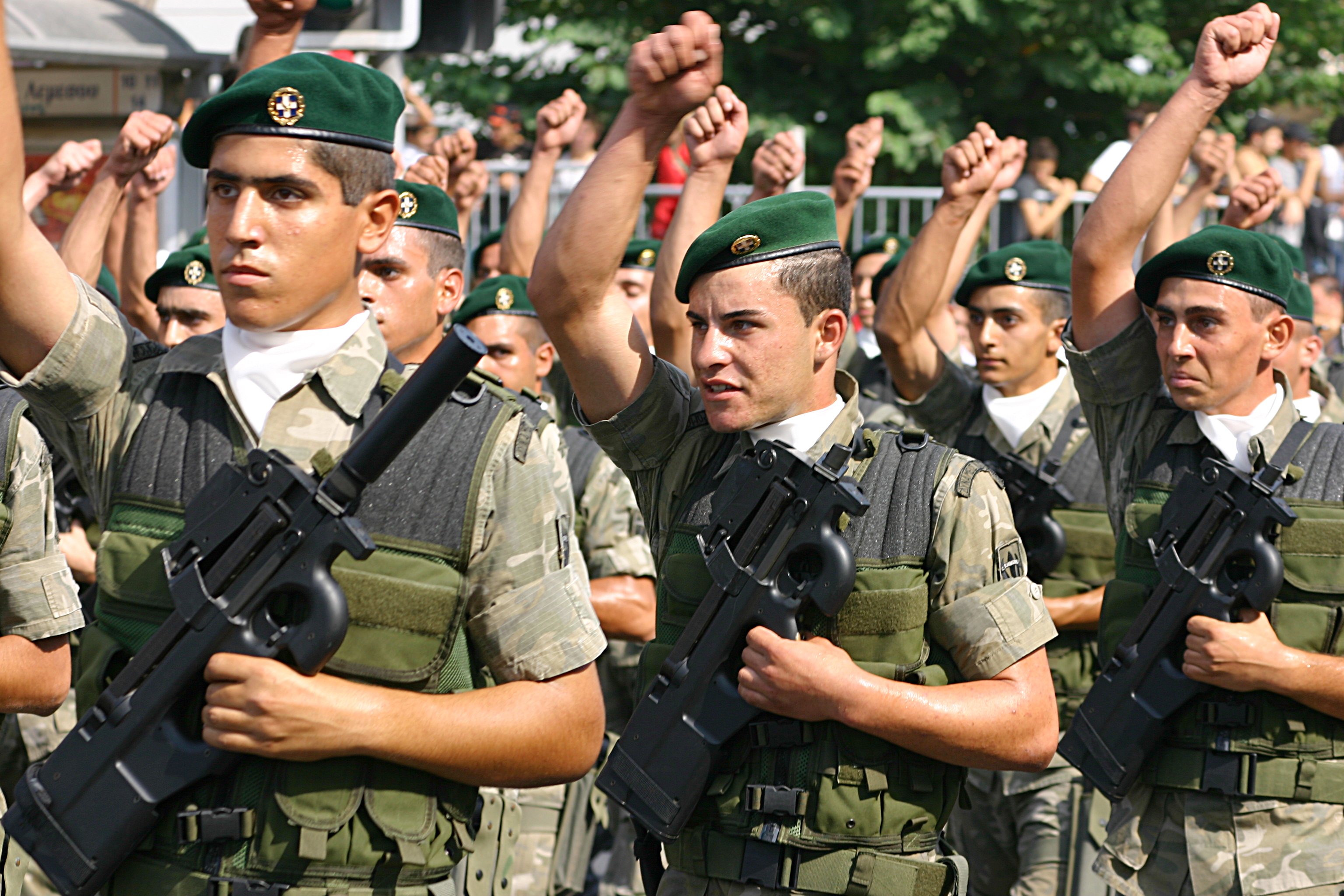 Figure 5 — Cypriot National Guard special forces on parade with P90s. Cyprus is among the documented national adopters; the pattern of adoption — special forces and protection units rather than general issue …