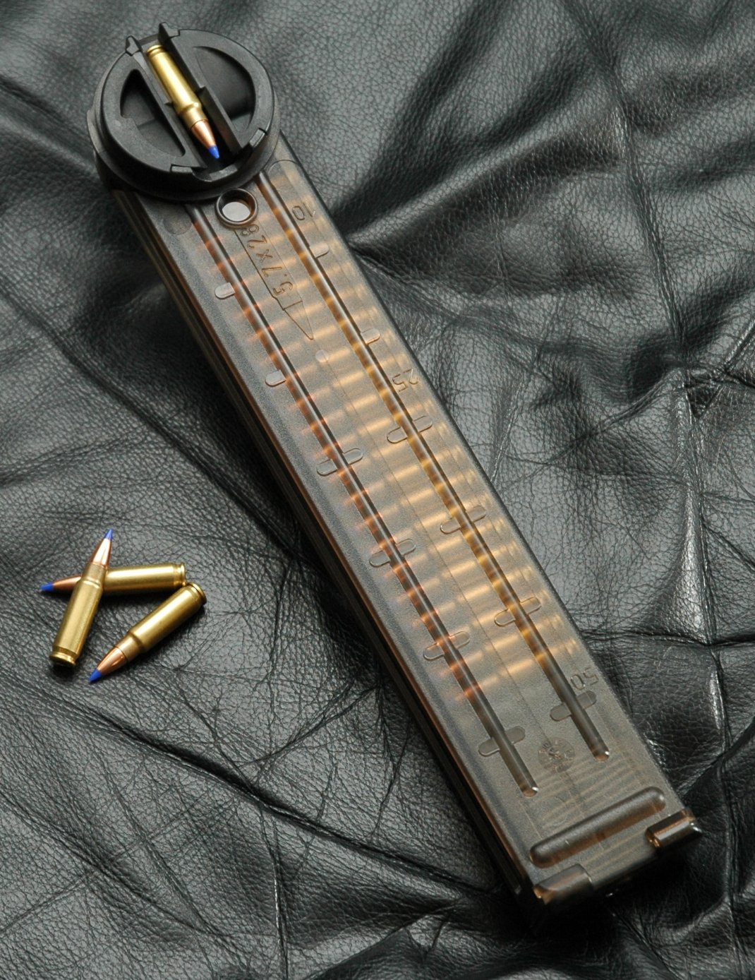 Figure 5 — The magazine body with cartridges. The internals — follower assembly and two rollers — are what make the rotating feed work, and they are what accumulate fouling.