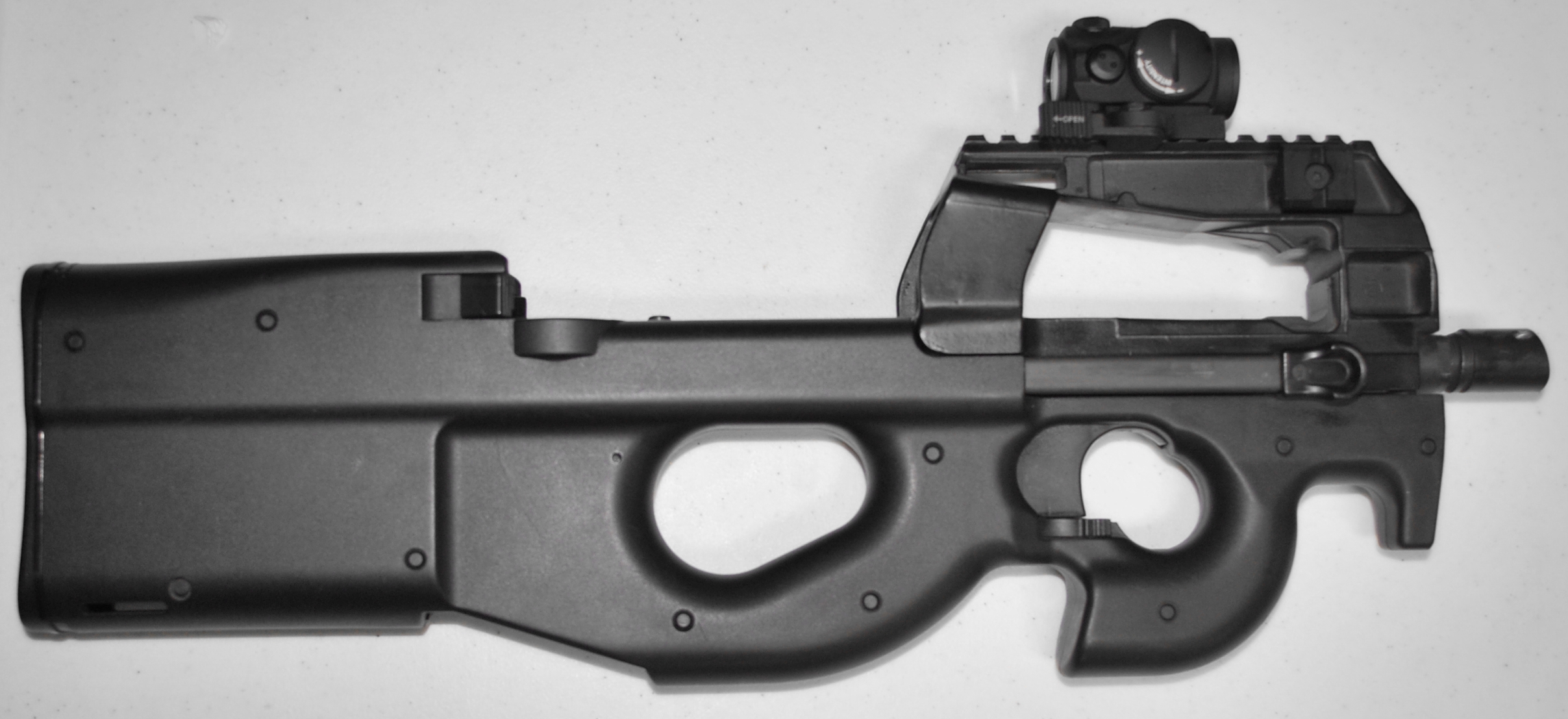Figure 3 — A P90 TR. The rail replaces the moulded optical housing entirely, and the weapon becomes a conventional host for whatever the customer's optic policy specifies.