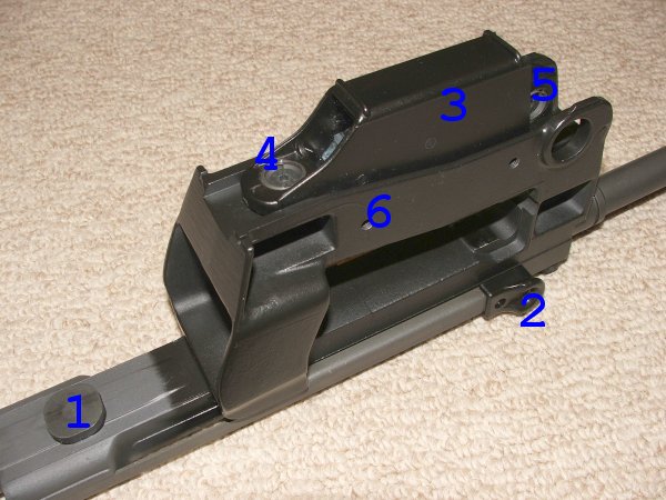 Figure 2 — The barrel support and upper rail group, removed and numbered. It comes out as a single assembly carrying the barrel.