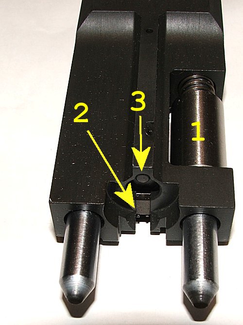 Figure 3 — The breech end of the barrel group with its guide rods. The two rods and the spring assembly are what the moving parts group runs on.