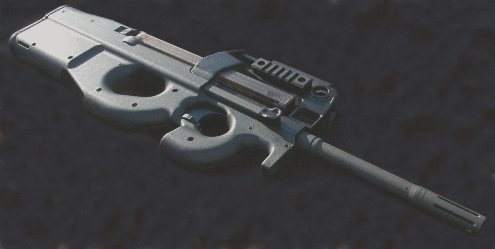 Figure 2 — A PS90 with a rail-mounted optic in place. The height of the sightline above the bore is a direct consequence of routing the magazine over the receiver.