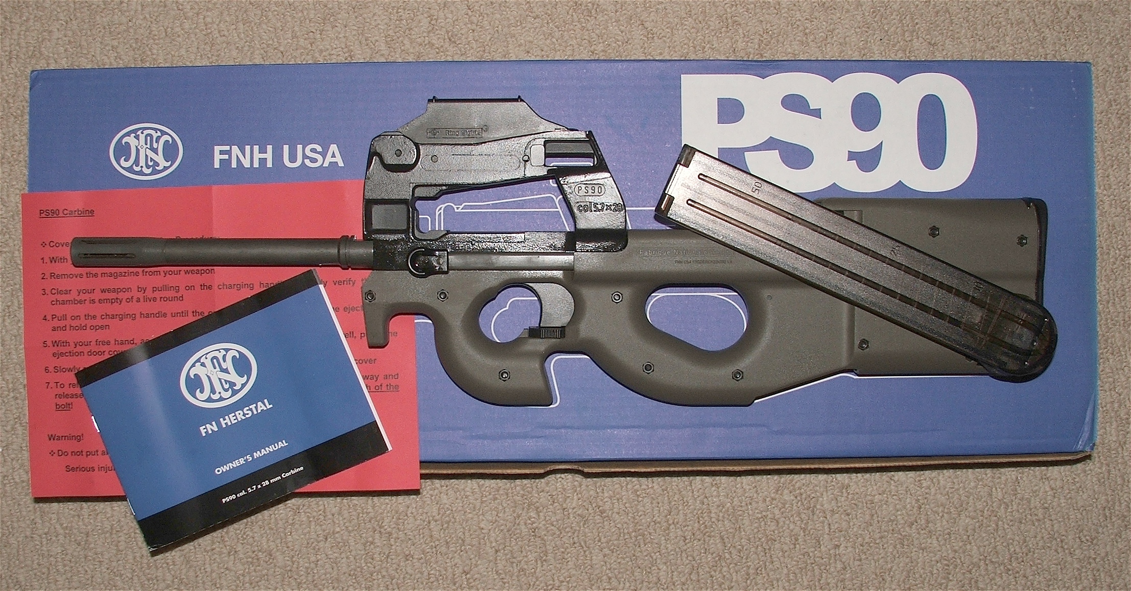 Figure 5 — A PS90 as sold, with its box, manual and paperwork. For most buyers this is where the legal analysis ends — it is an ordinary rifle purchase.