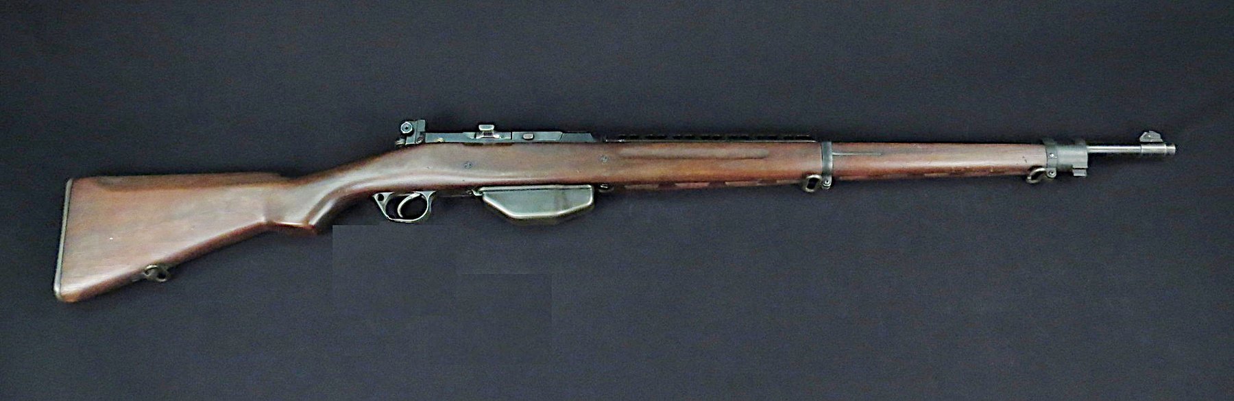 Figure 4 — The Pedersen T1 semi-automatic rifle in .276 Pedersen, the rifle Garand's design had to beat. Its toggle lock works like a Luger's, delayed rather than gas-operated, which is why it needed lubricat…