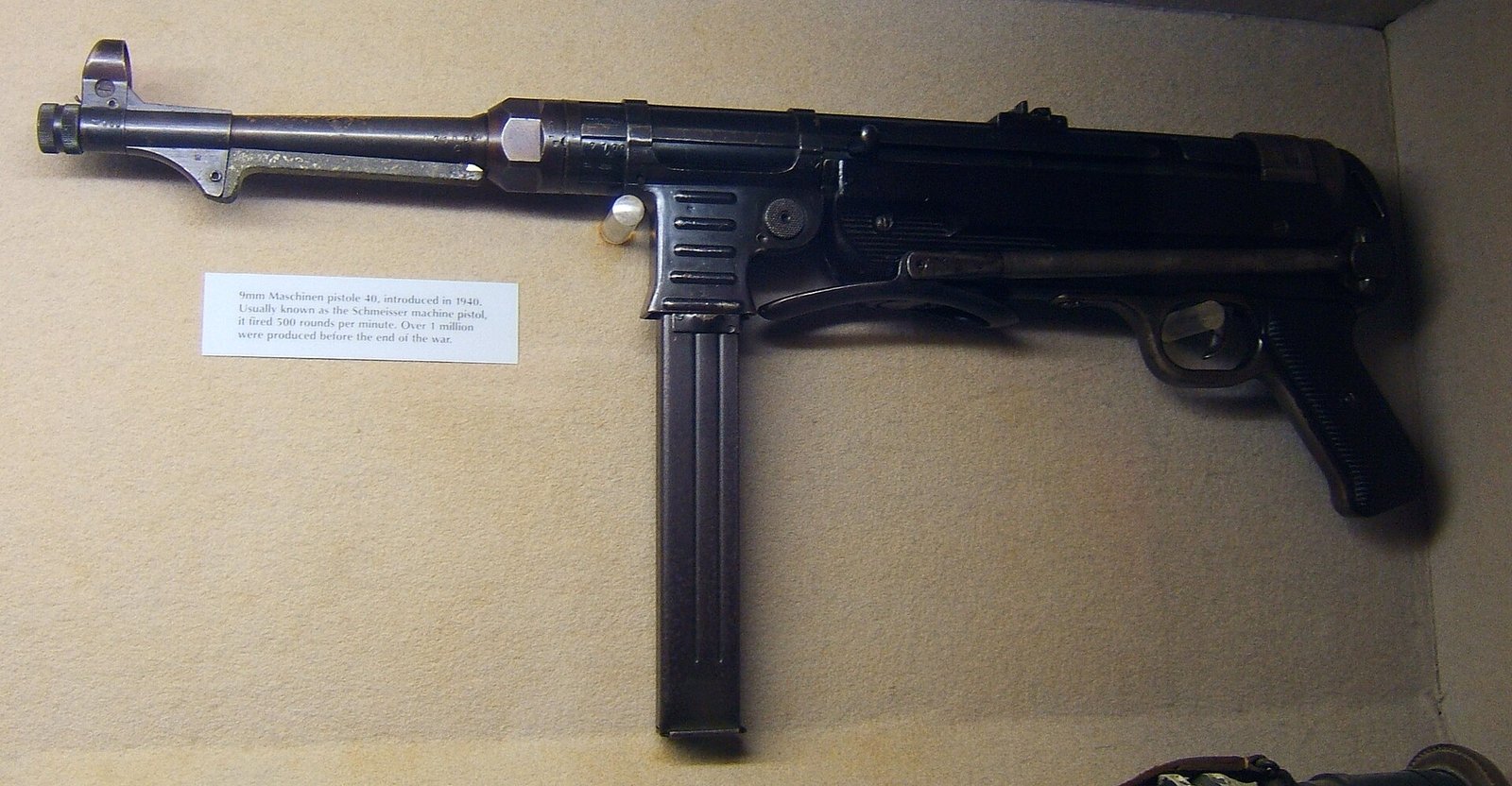 Figure 1 — An MP 40 with the stock extended, seen from the left. Most of what an owner needs to inspect is visible in a photograph like this one: the receiver's condition around the magazine well, the cocking…