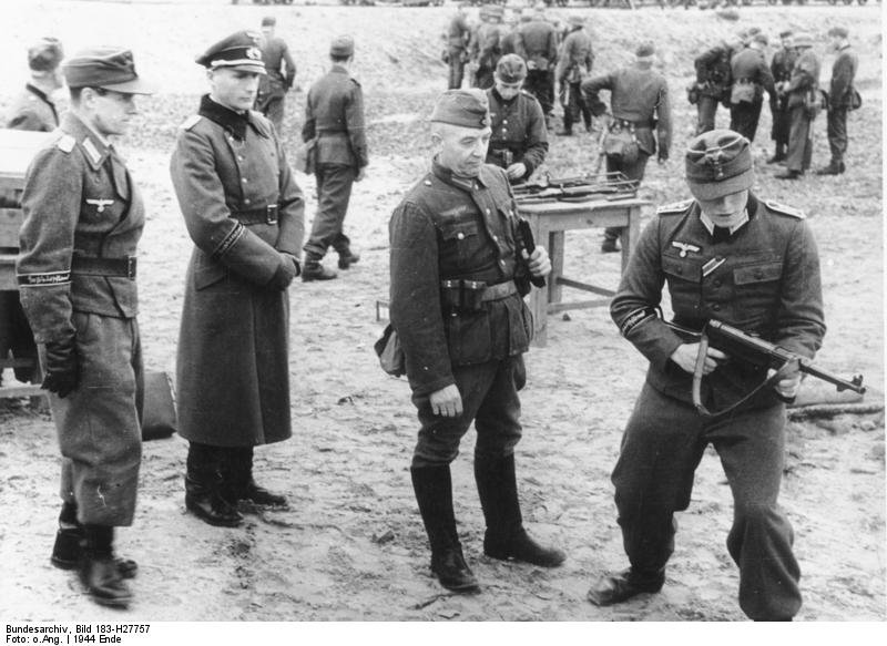 Figure 4 — Volkssturm training on the MP 40. A weapon with one fire mode, no adjustable sights and a simple manual of arms is a weapon that can be taught to an untrained man in an afternoon — which by late 19…