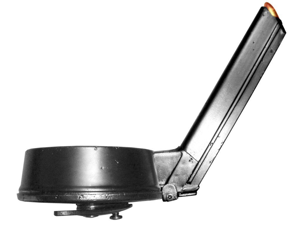 Figure 4 — The Trommelmagazin 08 snail drum, the MP 18's original feed device. The straight box magazine that replaced it after 1920 is the component around which the entire Schmeisser misattribution was built.