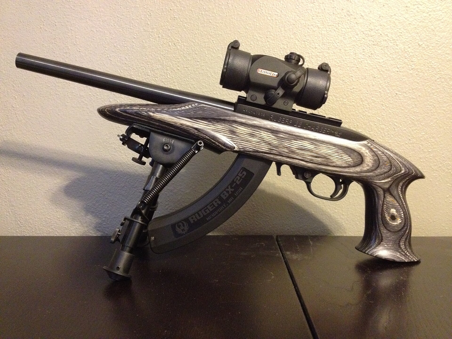 Figure 5 — A Ruger 22 Charger — a 10/22 action in a pistol stock with a short barrel and a bipod — with a pistol scope. The magazine is a Ruger BX-25.