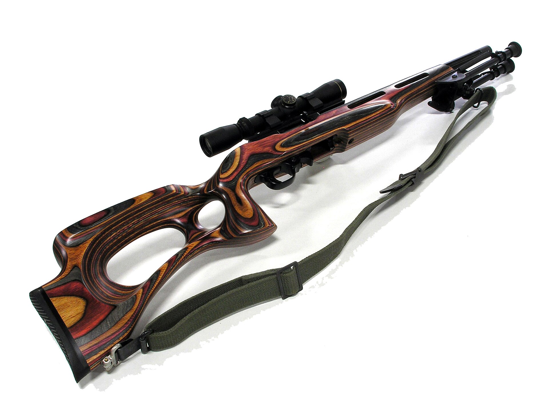 Figure 1 — A heavily built-up 10/22: laminated thumbhole stock, a Tactical Solutions lightweight aluminium-sleeved bull barrel, a Volquartsen hammer kit, a quick-release bolt lock, an extended magazine releas…