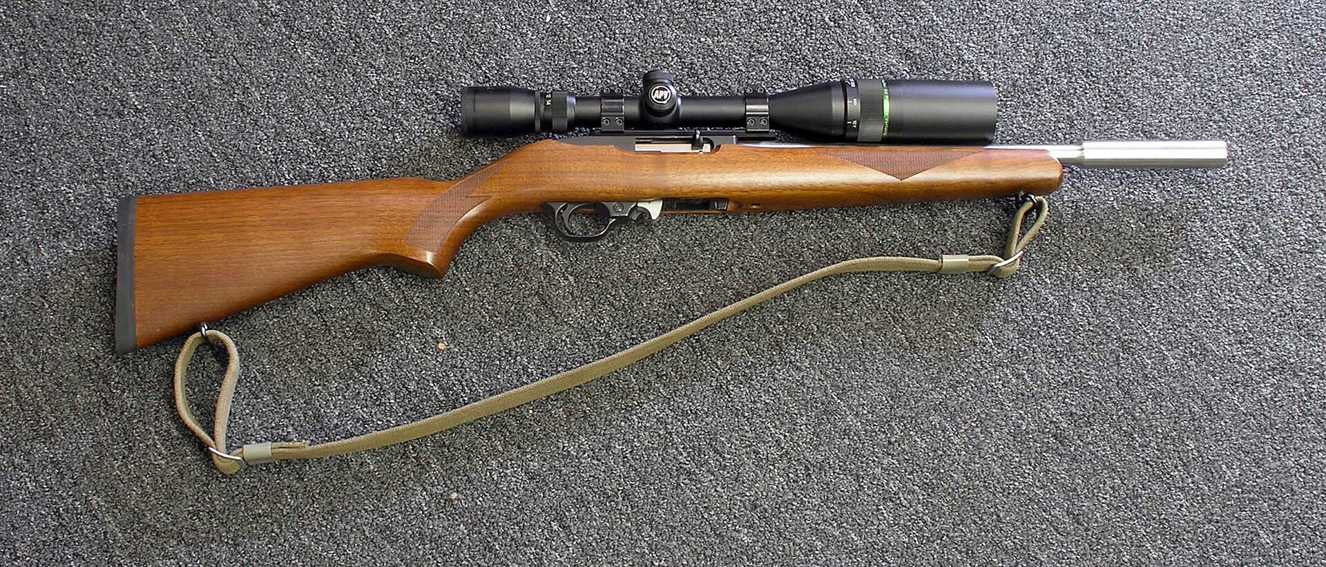 Figure 4 — A rifle that began as a 10/22 Sporter, bought — in its owner's words — for "the fancy walnut stock," since fitted with a Volquartsen muzzle-weighted barrel, an aftermarket trigger with an automatic…