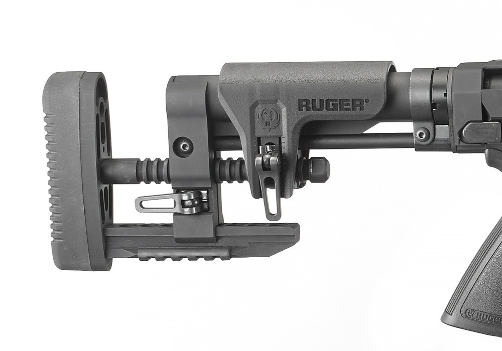 Figure 13 — The Precision MSR stock of the 2016 rifle: the adjustable cheek piece with the Ruger eagle, the length-of-pull rod with its cam levers, the bottom Picatinny rail and the soft butt pad.