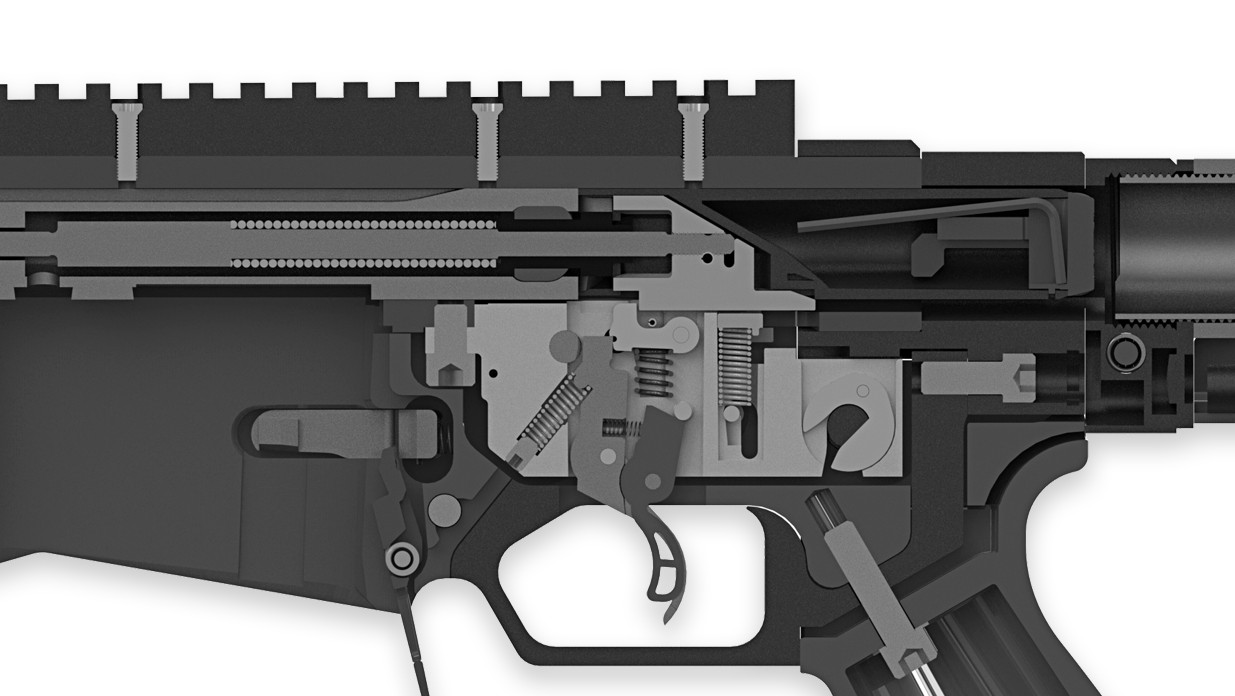 Figure 2 — Ruger's cutaway of the trigger group in place: the trigger with its centre release blade, the sear above it, the springs, and the magazine latch lever pivoting at the rear of the magazine well. The…