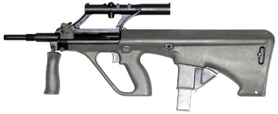 Figure 14 — Steyr's own photograph of the 9 mm AUG, shown at its original size: a slim barrel with no flash hider, the integral optic, and a narrow magazine in an insert in the well. Photograph: Steyr Mannlich…