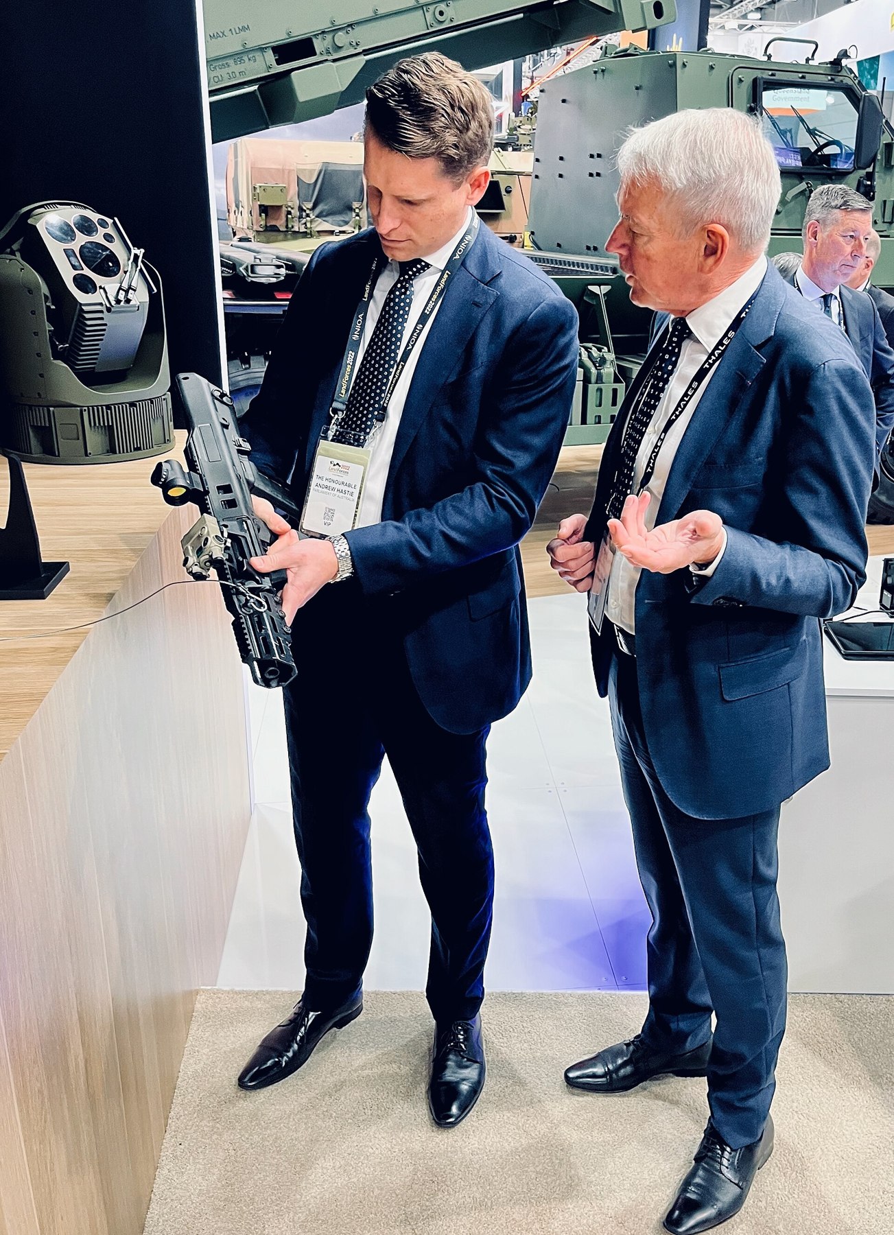 Figure 13 — Andrew Hastie holding an F90 with a delegate at the Land Forces exhibition in Brisbane in October 2022. Photograph: N Lee, CC BY-SA 4.0.