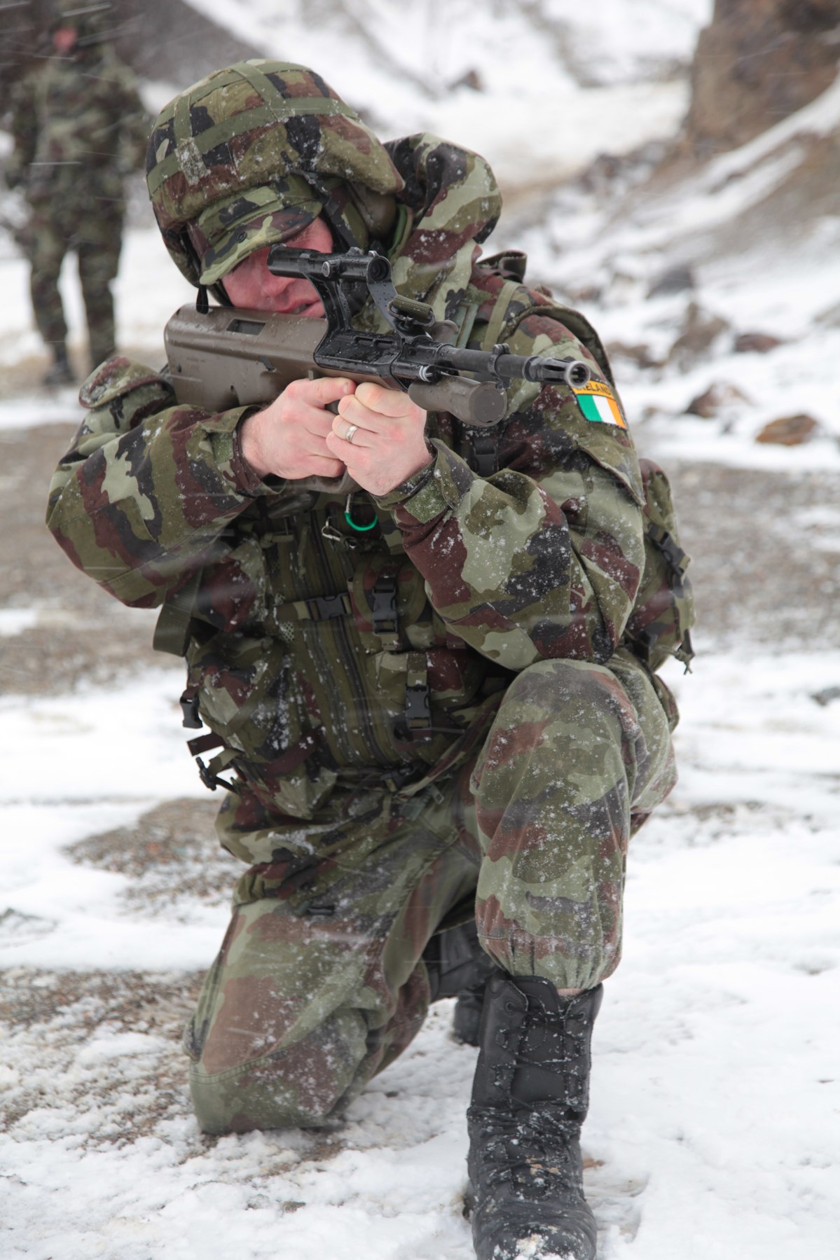 Figure 17 — An Irish soldier setting the sights of his AUG on the ranges with the Kosovo Force in March 2010. Photograph: Irish Defence Forces, CC BY 2.0.