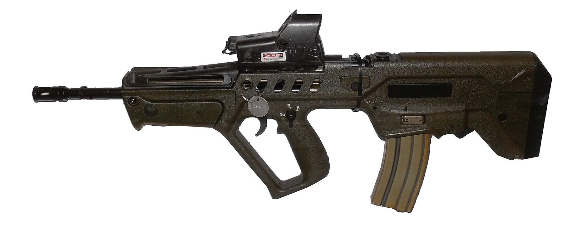 Figure 15 — Not an AUG: an IWI Tavor TAR-21. It is a bullpup with the magazine behind the grip and a full trigger guard, but the barrel is enclosed in a long polymer handguard with no folding vertical grip, th…