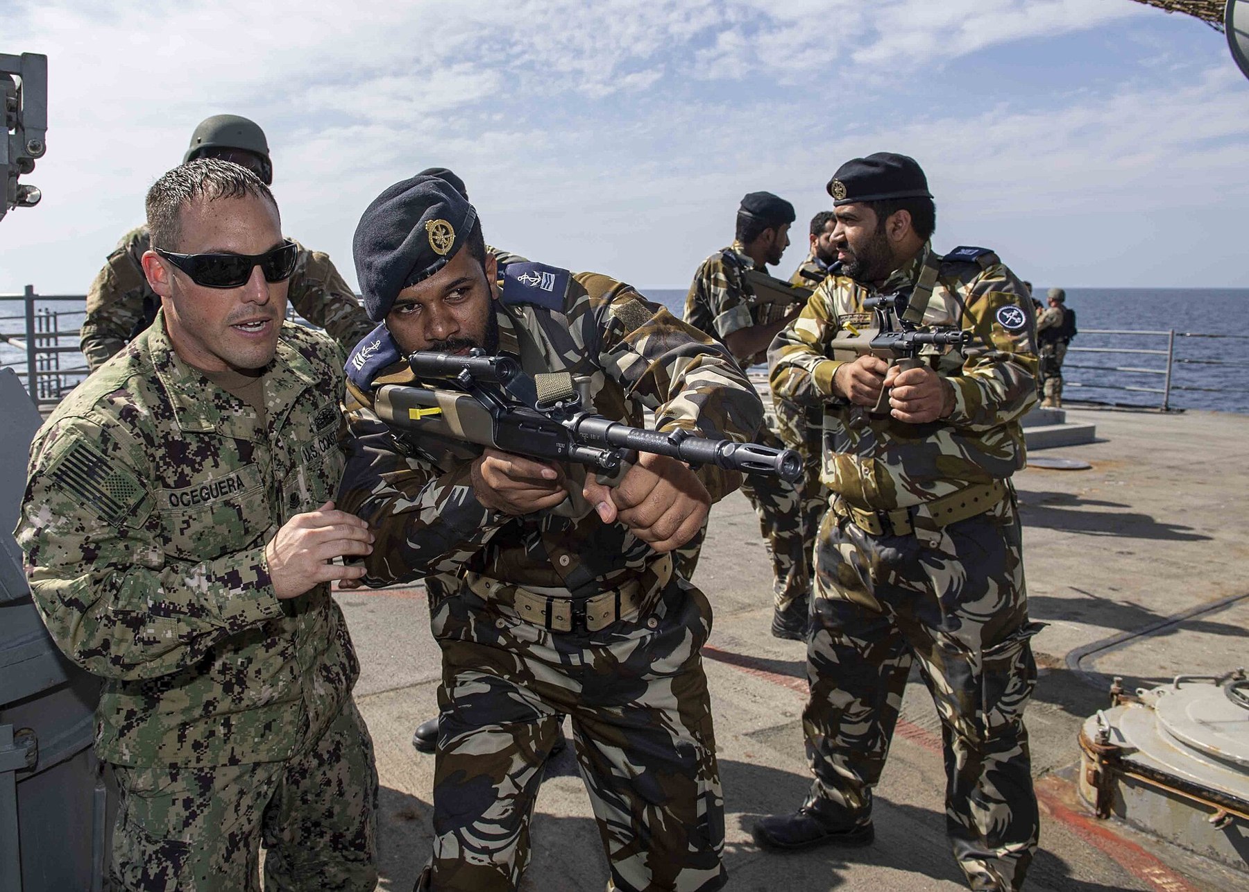 Figure 2 — Royal Navy of Oman sailors training with a US Coast Guard instructor aboard USS Normandy in the Gulf of Oman in 2019. Oman's armed forces received AUGs from 1983. Photograph: US Navy, public domain.