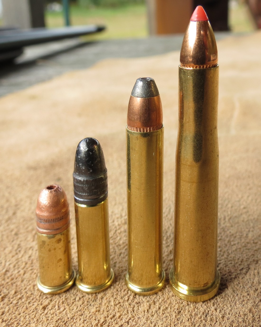 Figure 2 — Four .22-calibre cartridges to a common scale — .22 Short, .22 Long Rifle, .22 WMR and, at right, the centerfire .22 Hornet included for size reference. The step from Short to Long Rifle is 0.19 in…
