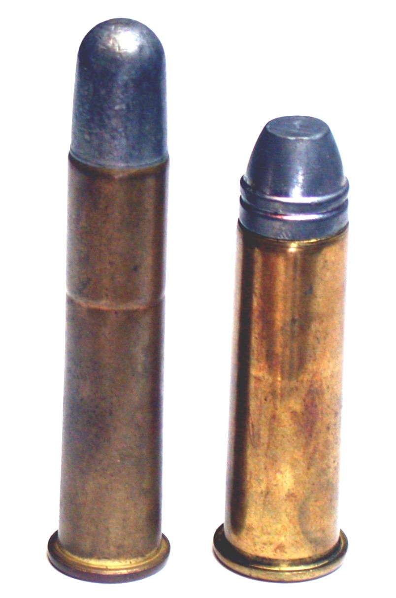 Figure 2 — .45-70 Government beside .50-70 Government, its immediate predecessor. Smaller bore, longer case, better sectional density, flatter trajectory: the .45-70 was a deliberate ballistic improvement rat…