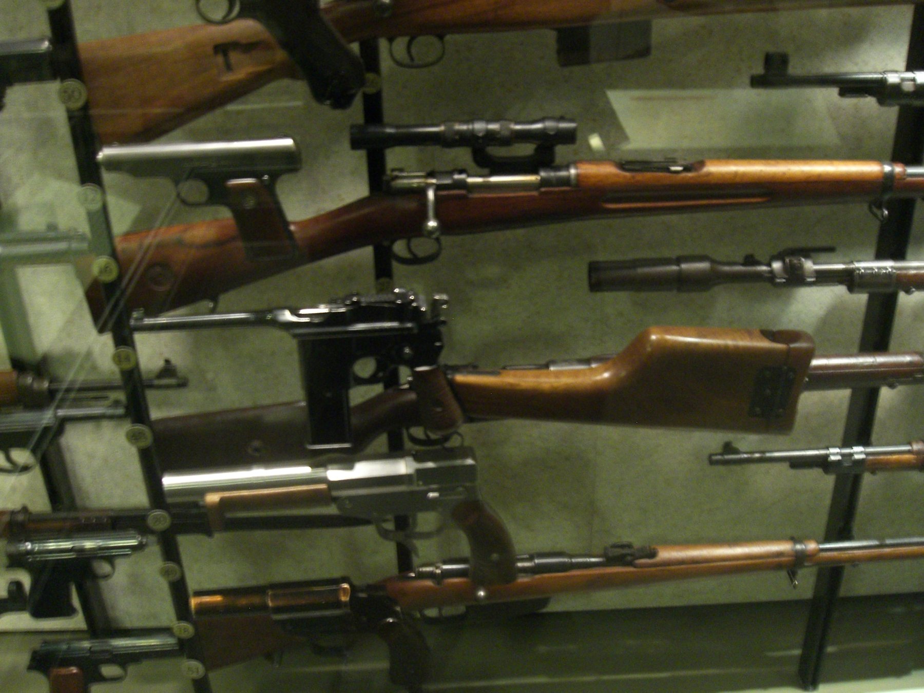 Figure 3.4 — Mauser C96 M712 "Schnellfeuer" (selective-fire variant, ~98,000 produced 1932-1937), shown with the wooden shoulder-stock holster attached. The detachable 20-round box magazine and fir…