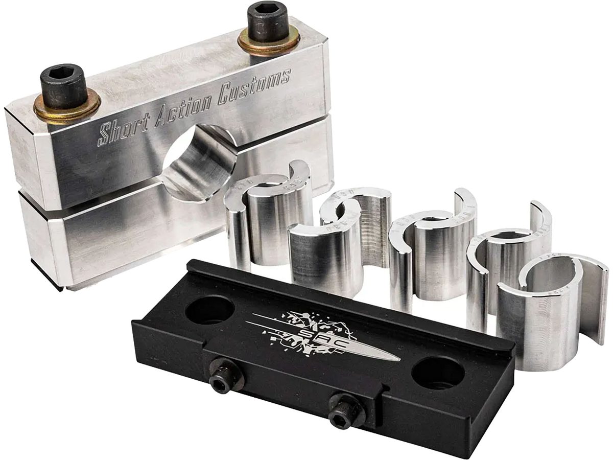 Figure 2 — A barrel vice with interchangeable bushings, and an action block. Both are needed to break a barrel loose without marking it or twisting a receiver. Source: retail product photograph.