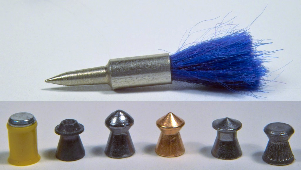 Figure 3 — Six .177 diabolo pellets in strict side profile. The head shapes differ - round, pointed, flat, hollow - but every one shares the two features that matter: the pinched waist and the thin skirt flar…