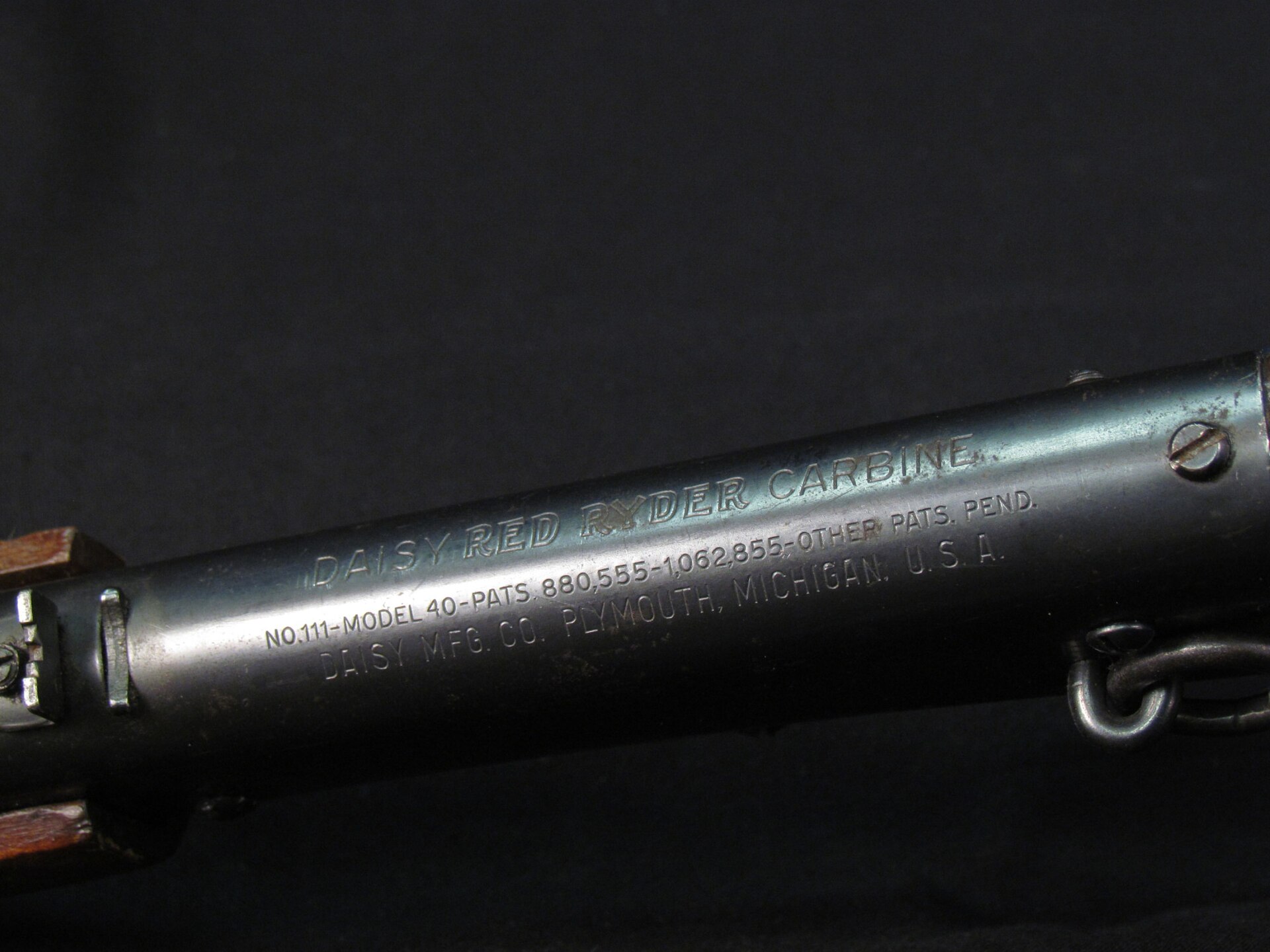 Figure 2 — Barrel rollmark on a Red Ryder Carbine: "DAISY RED RYDER CARBINE / NO. 111-MODEL 40-PATS. 880,555-1,062,855-OTHER PATS. PEND. / DAISY MFG. CO. PLYMOUTH, MICHIGAN, U.S.A." This is a model-and-patent…