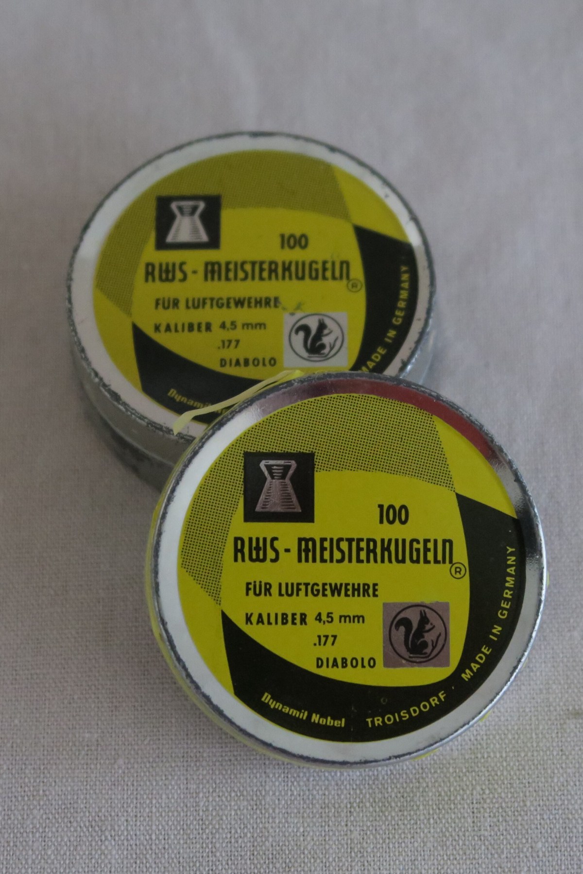 Figure 3 — Two tins of RWS Meisterkugeln .177 pellets from about 1970, marked for air rifles, caliber 4.5 mm, Dynamit Nobel, Troisdorf. RWS was an ammunition name before it was an American rifle name.