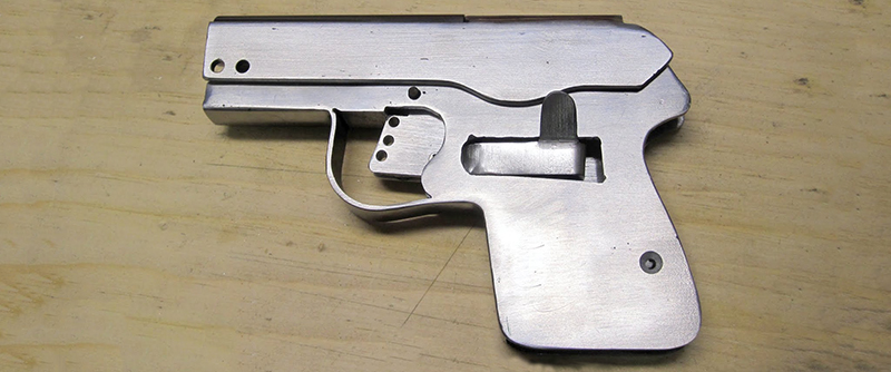 Figure 2 — A hobbyist sheet-metal pistol build whose author cut rifling in-house specifically to keep it an ordinary pistol rather than an AOW — one of three independent parties that read the statute the same…