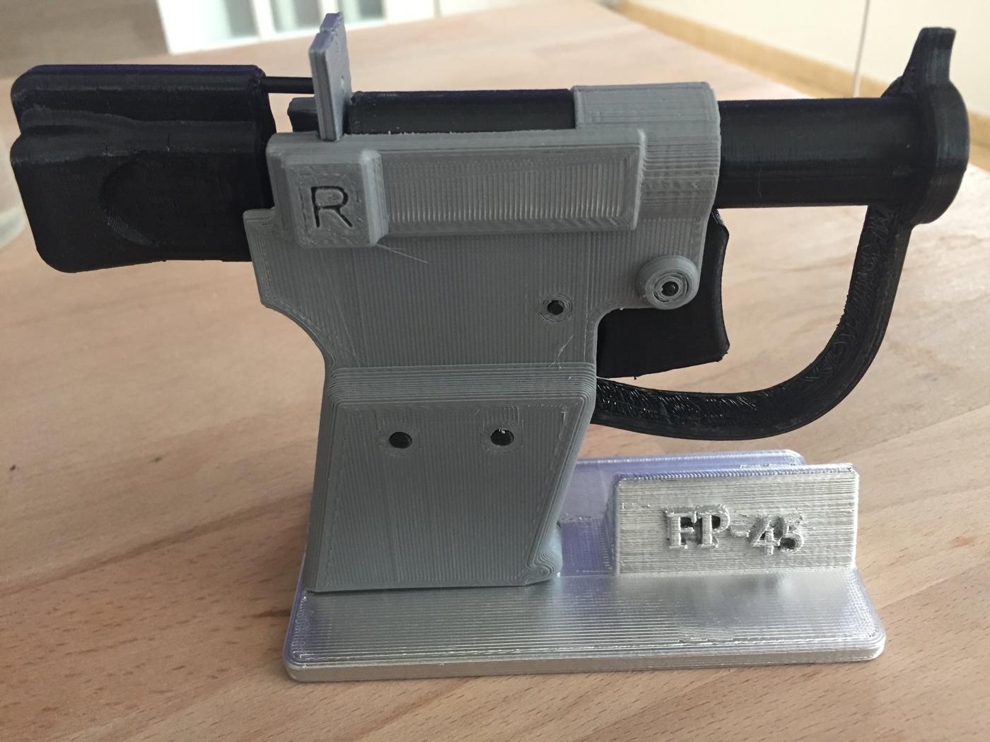 Figure 4 — A 3D-printed FP-45 "historical prop" — non-functional (no firing pin, undersized chamber), useful only as shape reference. Source: thingiverse.com.
