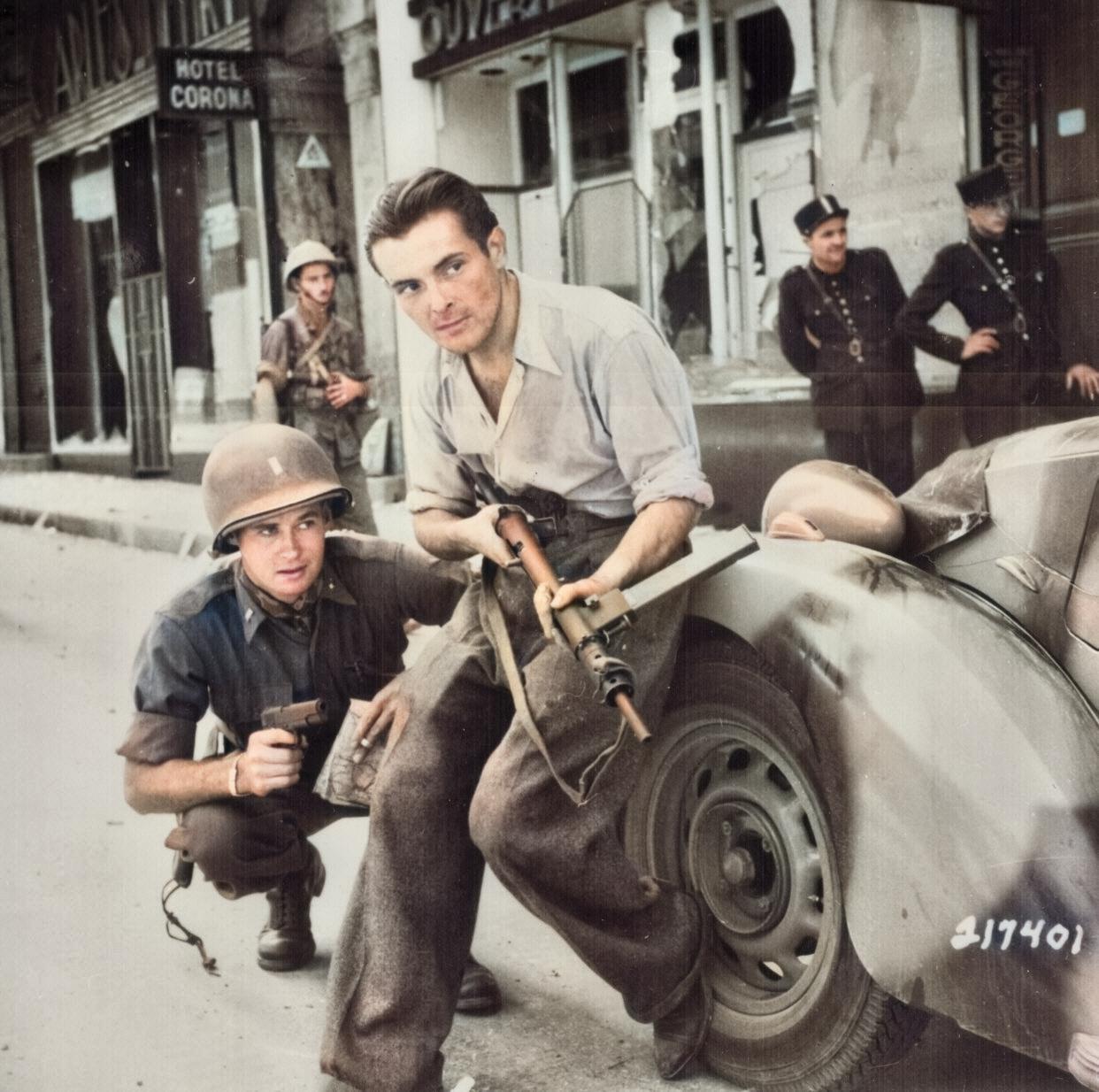 Figure 2.6.1 — A French resistance fighter in 1944 with a STEN (Mk II, by the magazine-housing geometry visible). The STEN arrived in occupied France via SOE airdrop in canisters along with food an…