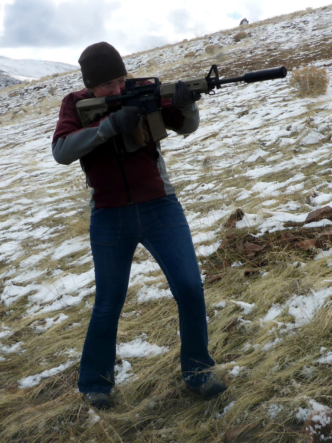 Figure 3 — A suppressed AR-15 being fired outdoors. With supersonic 5.56 the blast is gone and the crack is not, and the crack radiates from the bullet's flight path rather than from the shooter. Source: comm…