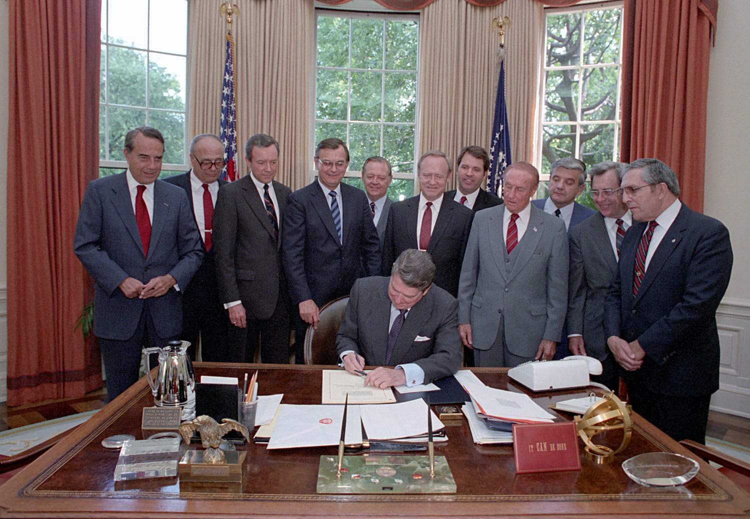 Figure 5 — President Reagan signing the Firearm Owners' Protection Act, 1986. FOPA closed the machine gun registry — and did not do the same to silencers, which is why one costs $500 and the other $30,000. So…
