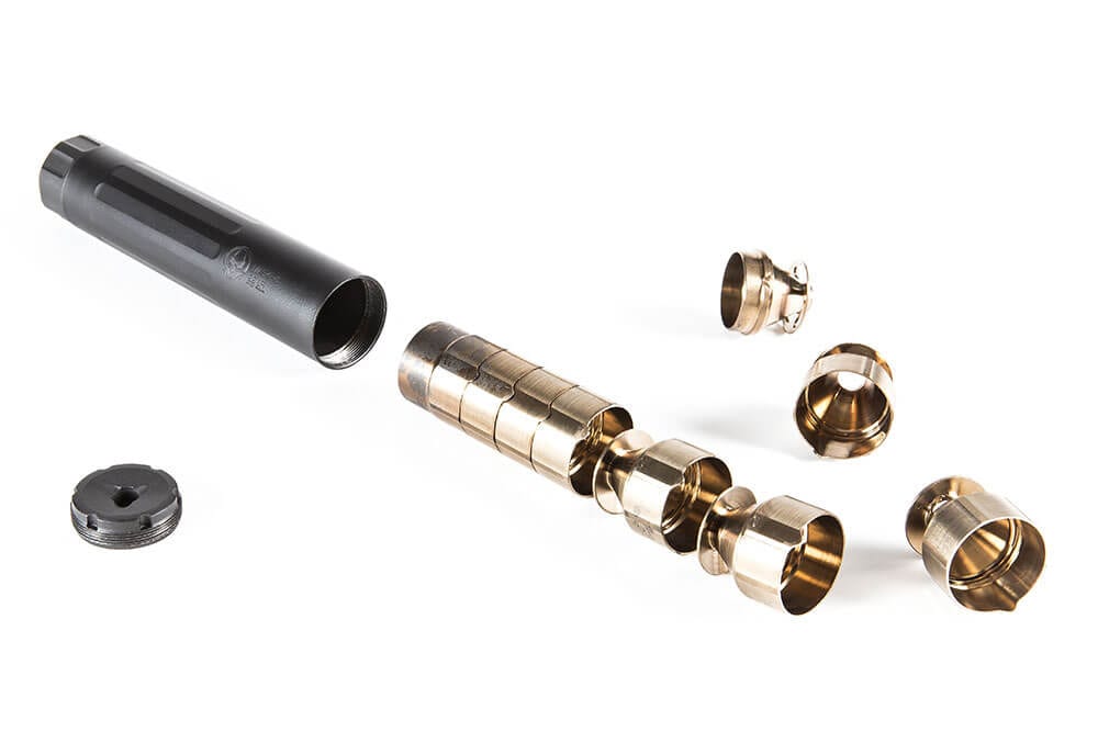 Figure 3 — A rimfire can broken down: tube, end cap, and the baffles laid out in order. Photographing the stack in index order before the first disassembly is the insurance §3.4 asks for. Source: web, referen…